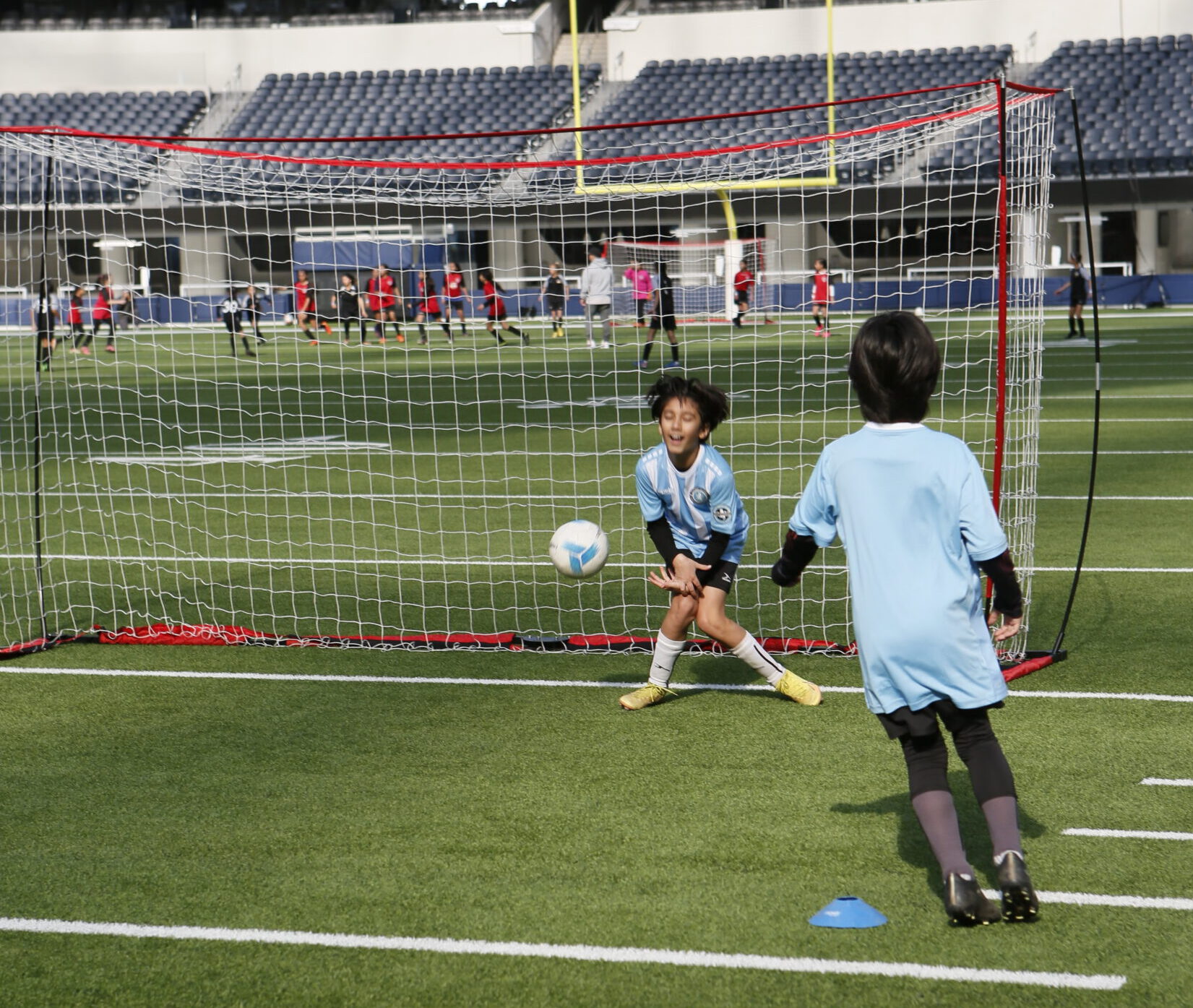 Goalkeeper making a save at a soccer class