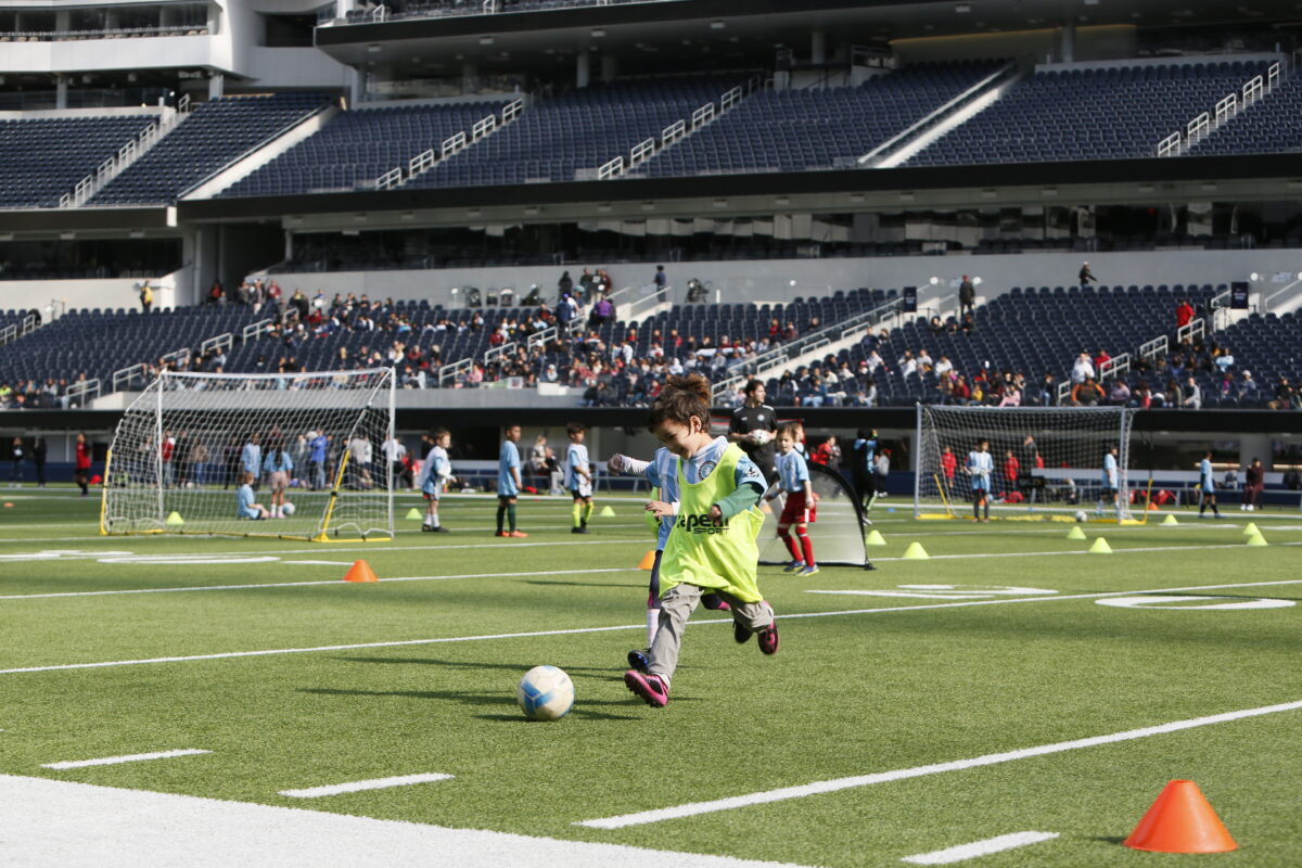 Pasadena children dribbling in a vibrant youth soccer game