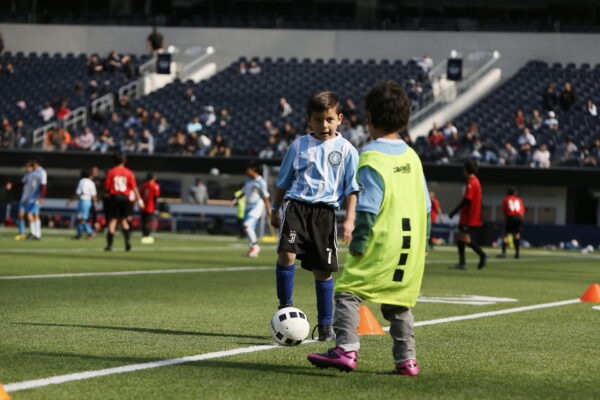 Soccer Class Boys. A boy playing soccer in his soccer class