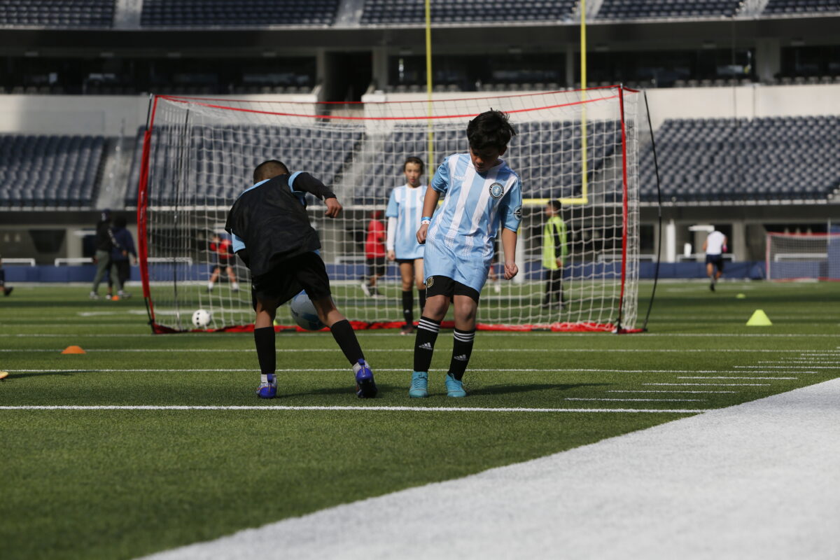 children playing soccer at their soccer class