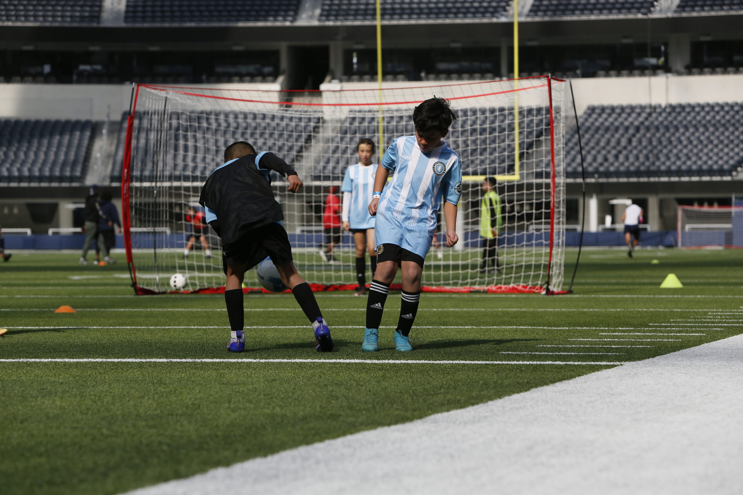 children playing soccer at their soccer class